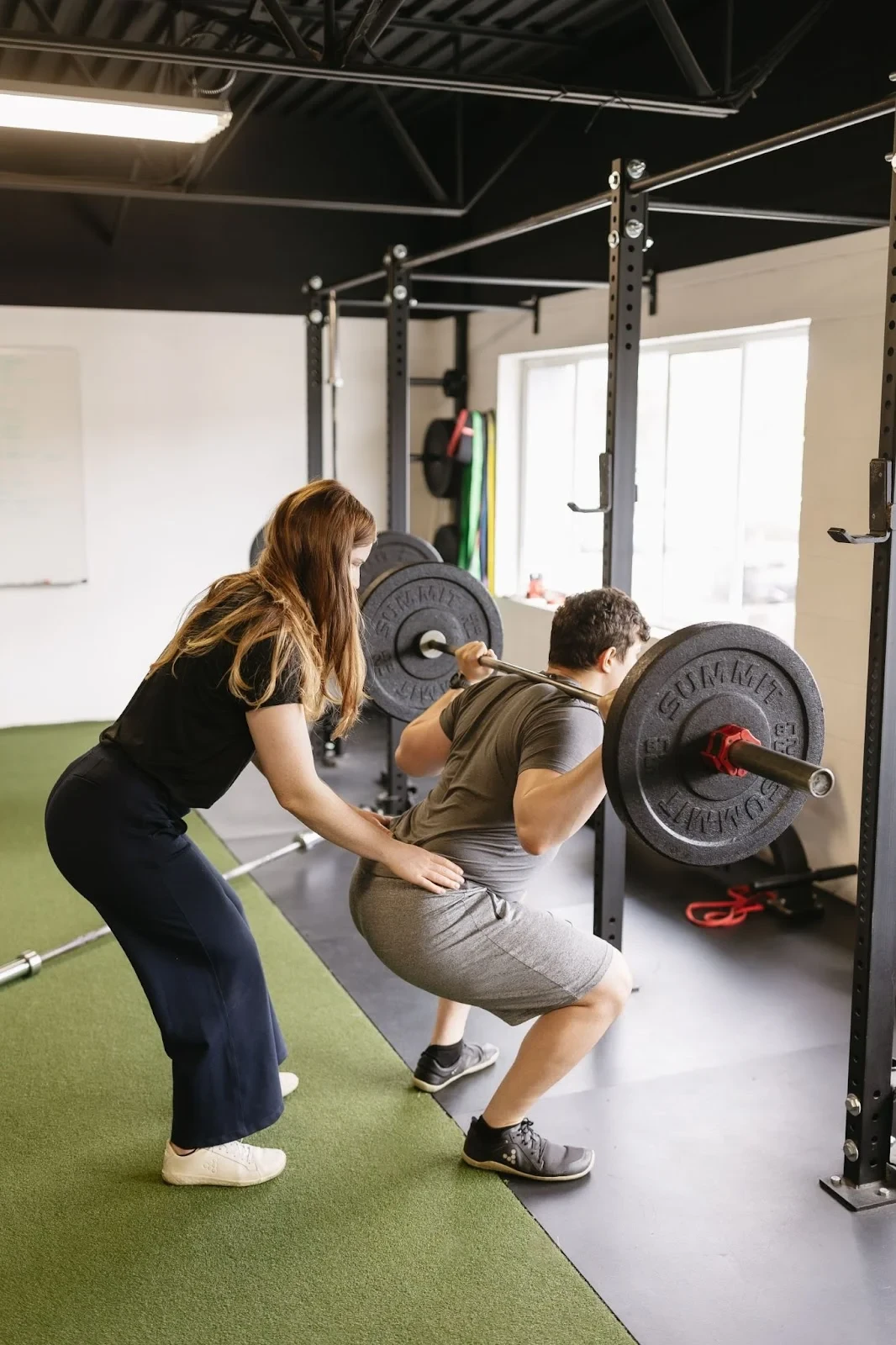 Physiotherapist guiding patient through corrective exercise program at At Ease Physio in South Surrey