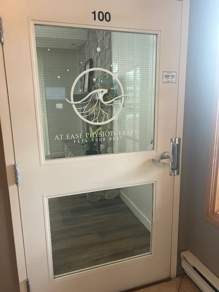 At Ease Physiotherapy entrance door with logo - Unit 100 at Morgan Crossing