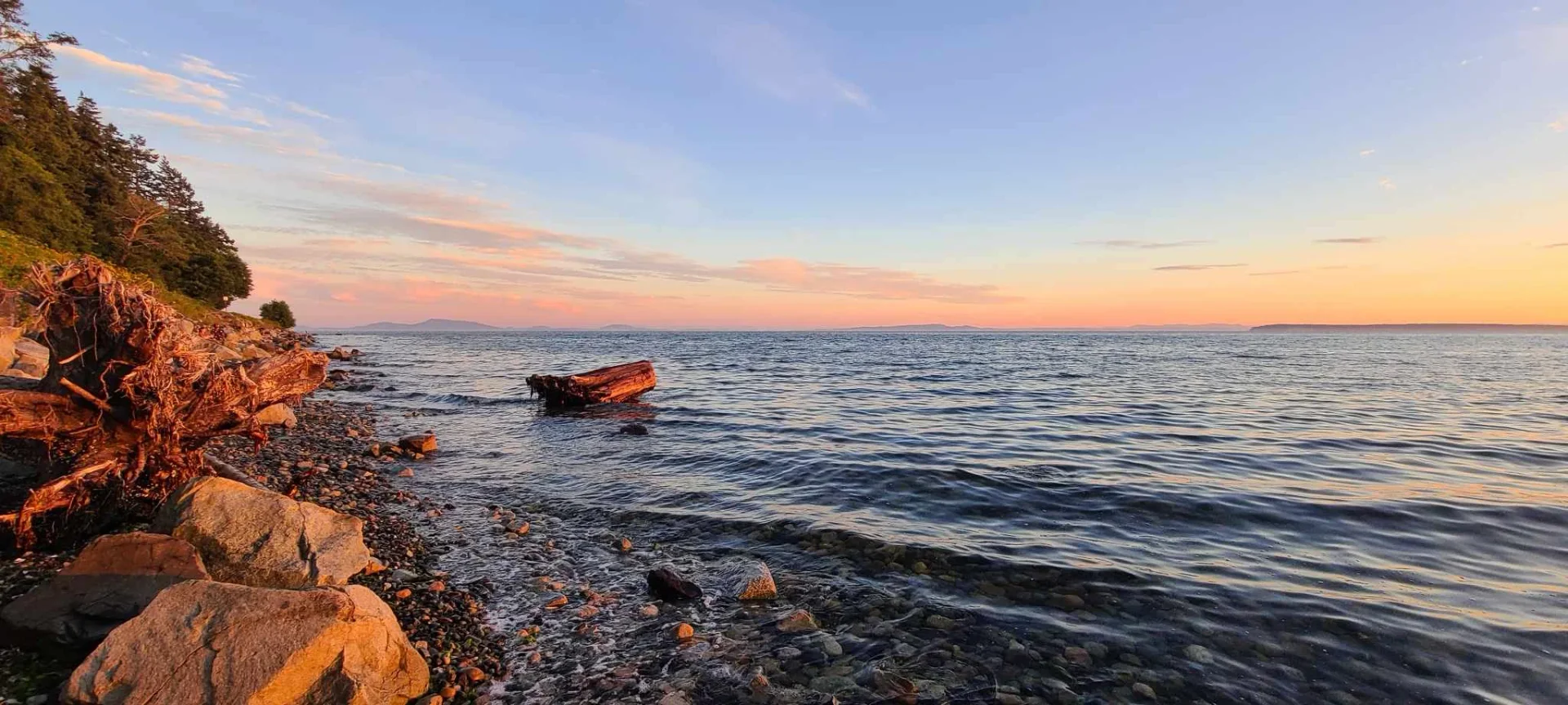 Peaceful sunset over White Rock beach promoting wellness and healing at At Ease Physiotherapy South Surrey