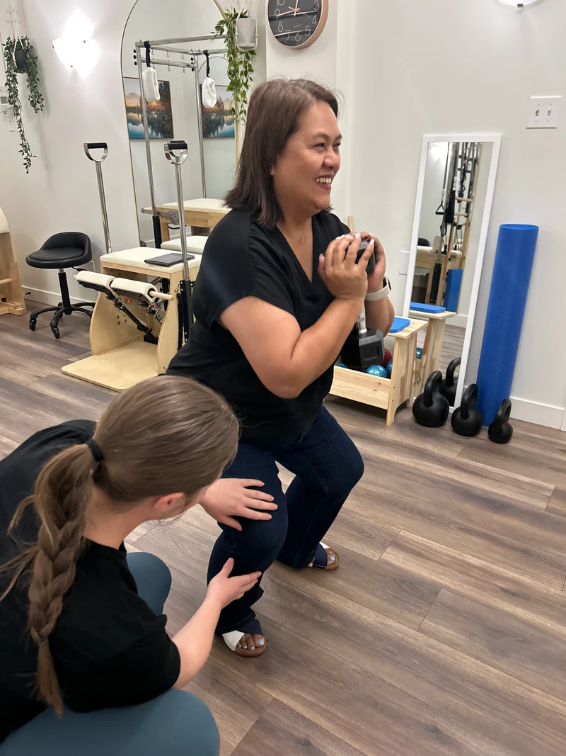 Kinesiologist guiding patient through active rehabilitation exercises at At Ease Physio in South Surrey