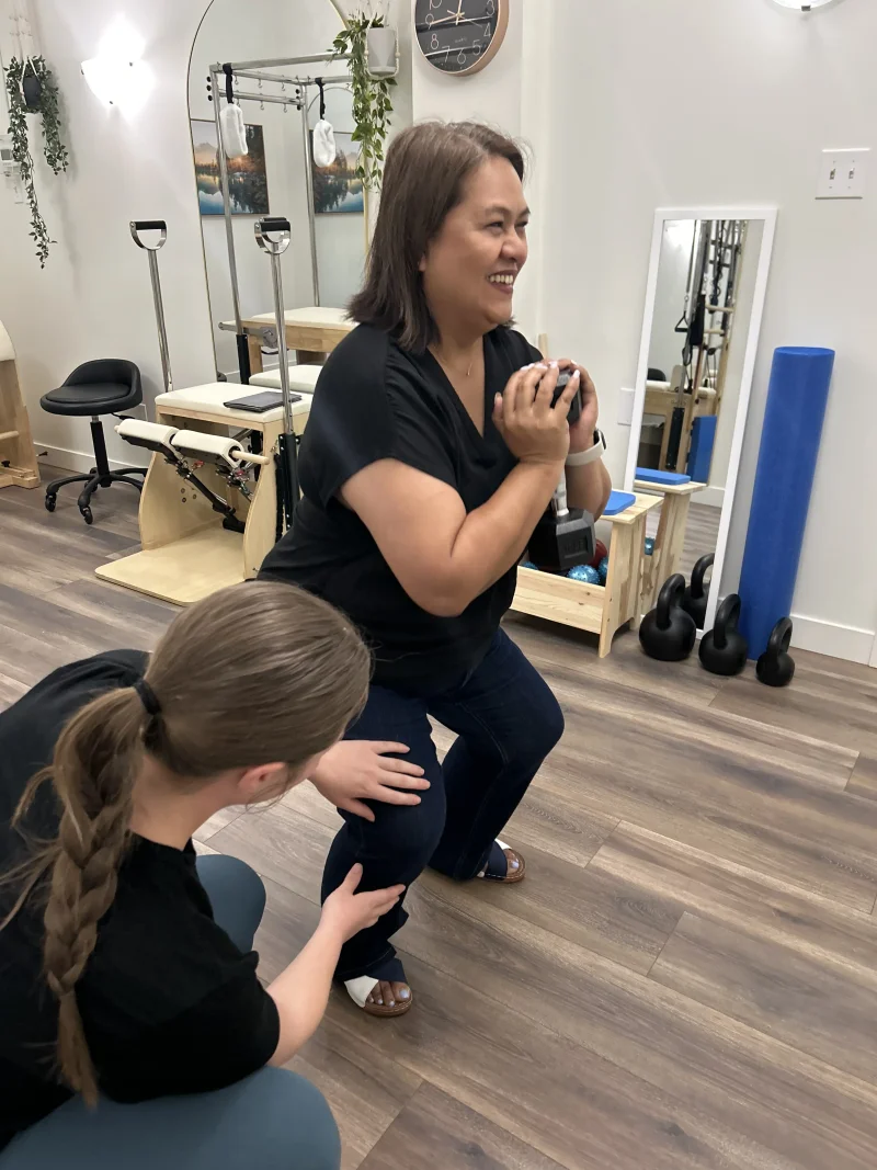 Kinesiologist guiding patient through active rehabilitation exercises at At Ease Physio in South Surrey