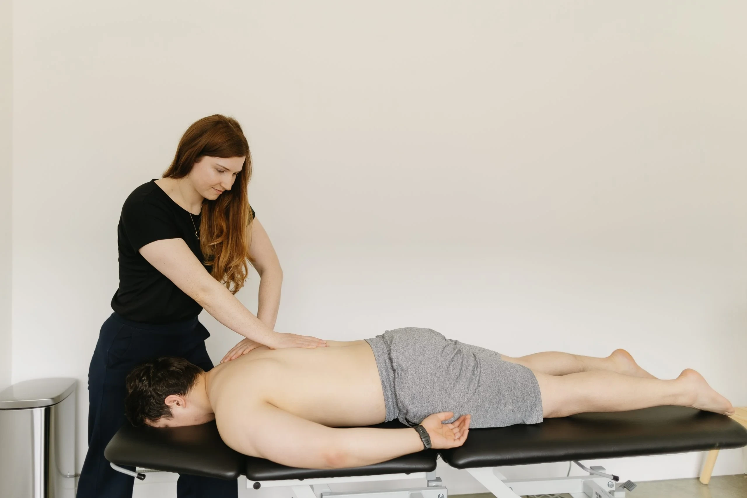 Physiotherapist providing hands-on manual therapy treatment at At Ease Physio in South Surrey