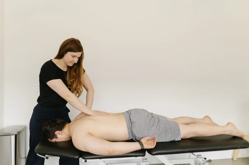 Physiotherapist providing hands-on manual therapy treatment at At Ease Physio in South Surrey
